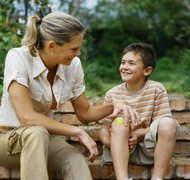 Stockbyte/Stockbyte/Getty Images The primary caregiver is the parent who has historically taken care of the children's needs.