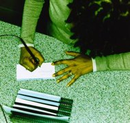 Ryan McVay/Photodisc/Getty Images A name confirmation from the court can help you change your name on bank accounts.