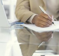 Ciaran Griffin/Stockbyte/Getty Images The executor of an estate manages the assets and pays the bills.