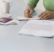 Digital Vision./Digital Vision/Getty Images Low income spouses may be eligible to have some or all of the court costs waived in West Virginia.