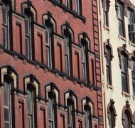 Stockbyte/Stockbyte/Getty Images Many multi-unit properties are owned by an LLC.