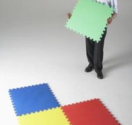 Aidon/Photodisc/Getty Images Interlocking business structures can help restrict liability to a single venture while allowing centralized control.