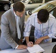 Jupiterimages/Pixland/Getty Images A power of attorney may grant your agent the power to sign contracts on your behalf.