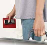 Jupiterimages/Polka Dot/Getty Images Owing child support can limit your travel options.