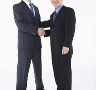 Jupiterimages/Polka Dot/Getty Images A living trust can be used to transfer assets from one generation to another.