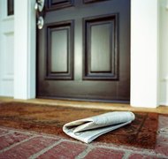 Siri Stafford/Photodisc/Getty Images Post a notification of your pending divorce in the local newspaper.