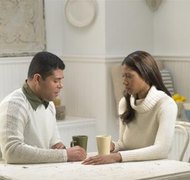 Andrea Morini/Photodisc/Getty Images A limited divorce may allow you to stay on your spouse's health insurance plan.
