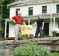 Creatas/Creatas/Getty Images Siblings can sell their parents' home and divide the proceeds equally..