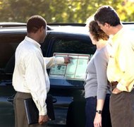 Thinkstock Images/Comstock/Getty Images An agent may sign the principal's car loan documents in New Hampshire.