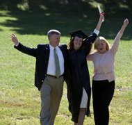 Comstock Images/Comstock/Getty Images Graduating high school seniors may be required to apply for college scholarships to offset costs.