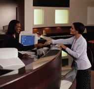 Keith Brofsky/Photodisc/Getty Images You need not name a benecificary for your checking account.