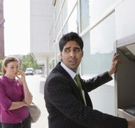 Jupiterimages/Polka Dot/Getty Images An account hold may occur without advance warning or notice from the bank.