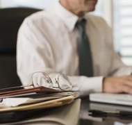 Jupiterimages/Comstock/Getty Images Probating a will is the responsibility of the executor of an estate.