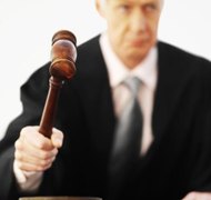 Stockbyte/Stockbyte/Getty Images Probate judges empower executors to pay burial expenses.