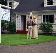 Ryan McVay/Photodisc/Getty Images Some states automatically restrict your ability to sell property once a divorce is filed.