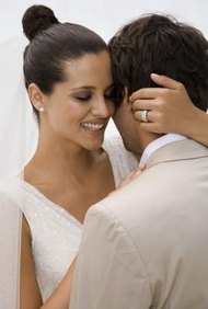 Jupiterimages/Goodshoot/Getty Images Marriage and a new name may require a new green card.