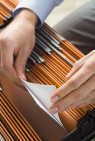 Jupiterimages/Polka Dot/Getty Images Your first step is to collect documentation proving your name change.