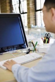 Jupiterimages/Polka Dot/Getty Images You can complete your provisional patent application online.