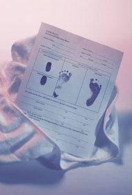Comstock/Comstock/Getty Images Correct a misspelled surname on your child's birth certificate.