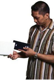 Ablestock.com/AbleStock.com/Getty Images La explosión de máquinas expendedoras de películas Redbox en todo el país da la apariencia de que todos los que quieren ser dueños de un negocio de quiosco Redbox pueden hacerlo.