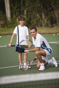 Comstock Images/Comstock/Getty Images Paying child support does not guarantee a right to visitation.