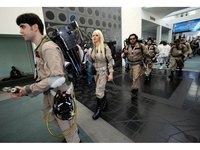 Ghostbusters wear protective overalls and have a proton pack.