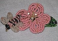 The flower and the bumblebee's wings are both made using the same technique.
