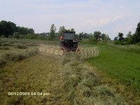 Raking hay field