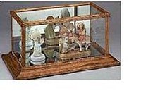 Use a picture frame for the bottom of your display case.
