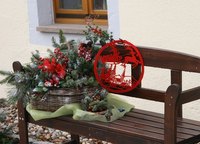 Create a festive Christmas-themed front porch with lights and other decorations.
