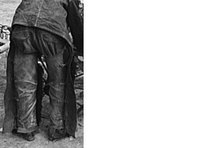 Traditional work chaps use buckles.