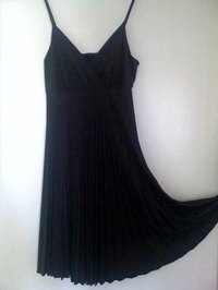 A black version of the classic Marilyn Monroe pleated dress.