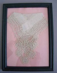 Framed vintage hankies make wonderful decorations