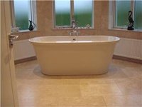 Travertine floor in a bathroom.