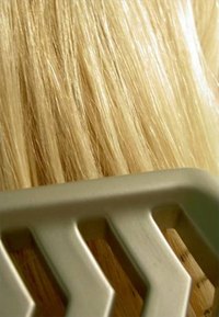 Get shiny, healthy hair that will stand up to processing, blowdrying and rough treatment by treating it regularly with olive oil.