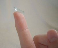 Contact lens on a finger.