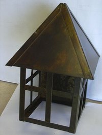 Antique Bronze Patina on a steel lighting fixture