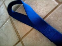 The looped end of the lifting strap goes around your forearm.