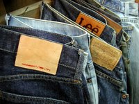 Get into smaller jeans by hiding belly fat with a body shaper.