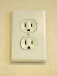 A standard electrical wall outlet.