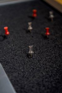 Push pins are the best kind of thumb tacks to use for easy removal.
