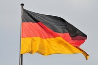 Obtain a German passport at your local Consulate.