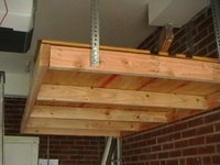 Hanging shelves provide extra storage space without supprt legs in the way
