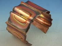 Fold formed copper bracelet with heat patina. Copyright GeltDesigns. All rights reserved.