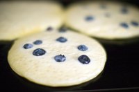 The large, flat surface of a griddle allows you to cook many pancakes at once.