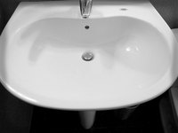 Clean black marks off your porcelain sink with vinegar.
