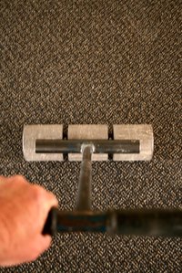 Commerical carpet is glued down to the floor to keep it from rippling over time.