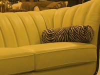 Make a sofa slipcover to extend the life of outdated seating.