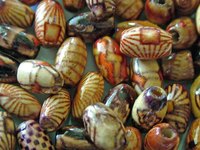 You can make paper beads that look like fired ceramic beads.