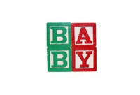 The old-fashioned alphabet building block is the inspration for these cardboard baby shower favor boxes.